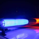 Police car light bar flashing blue and red at night