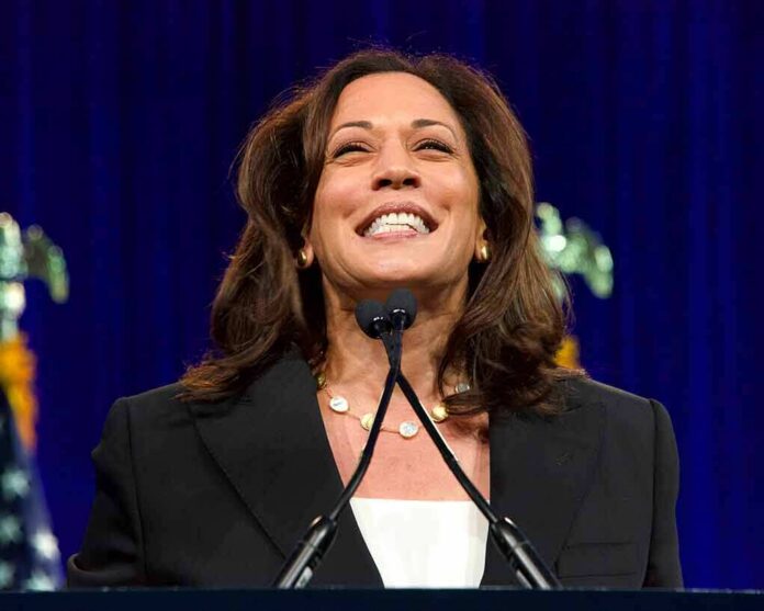 smiling woman speaking at a podium