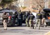 Sex Predator Maniac Terrorizes Neighborhood in Worst Possible Way Police and sheriff officers gather around vehicles on a suburban street