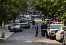 Man with 14 Prior Arrests CAUGHT Attacking White Women Police officers secure a residential street with patrol cars and yellow tape