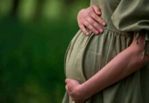Birth Tourism Prevention Task Force LAUNCHES! Pregnant woman holding her belly in a green dress