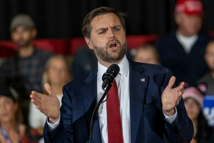 Man in suit speaking at a podium