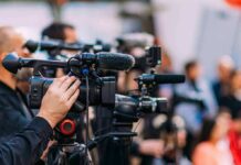 Video cameras on tripods at a media event