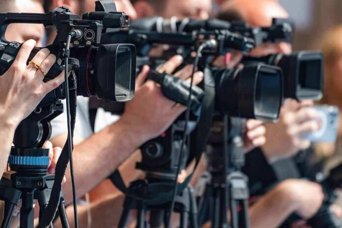 Camera,Recording,At,A,Media,Press,Conference,Preserves,Accurate,Details television cameras on tripods at a media event