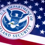 U.S. Department of Homeland Security seal on American flag