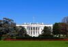 White House Chief of Staff Gives Shock Cancer Announcement The White House facade with flag and gardens