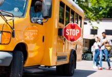 Fleeing Driver SMASHES Into School Bus — Then Bolts School bus with extended stop sign near students on sidewalk