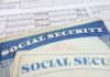 ICE Nabs Illegals in Social Security Sting Social Security cards on top of a tax form