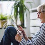 Older woman using a tablet at home