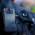 Body camera clipped to a dark uniform