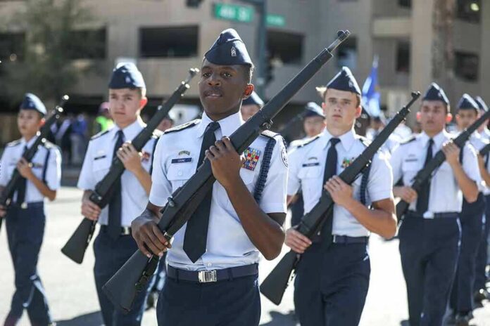 cadets marching in formation with rifles