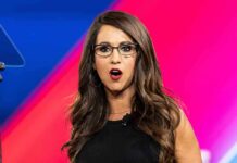 ‘I’m Not a Lesbian’: Boebert Blasts Ethics Complaint Allegations Woman with glasses speaking on stage with colorful backdrop