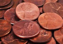Congress DESTROYS 242-Year American Staple pile of copper pennies with heads side up