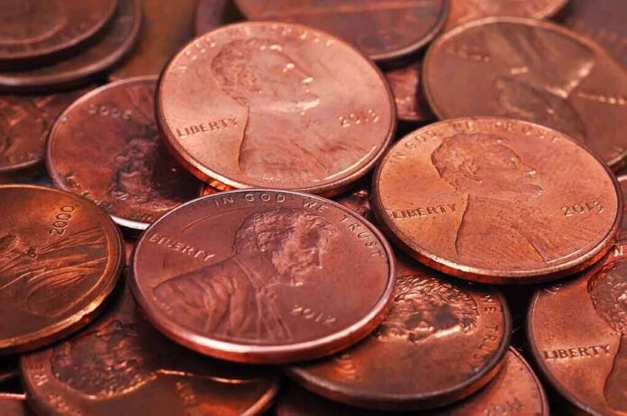 shutterstock_224586325 pile of copper pennies with heads side up