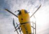 News Chopper CRASHES – Fireball Over City Yellow helicopter seen from below with spinning rotor against a bright sky
