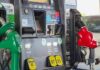 Gas pump with green diesel and red gasoline nozzles