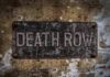 First in 200-Years – Female Inmate Put To DEATH Rusty metal sign on worn concrete wall