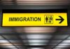 Immigration sign with arrow in airport