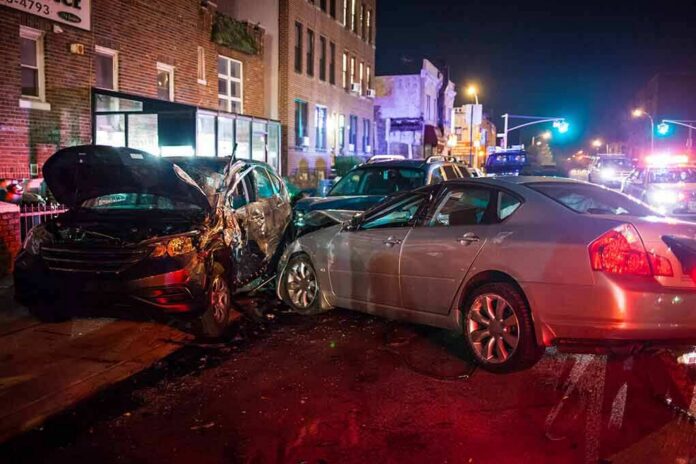 shutterstock_738738490 two cars collide on a city street at night