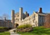 Gothic-style college building with archway and towers