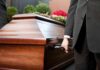 Star Trek Icon Gone – Fans Stunned Pallbearer holding a wooden casket handle