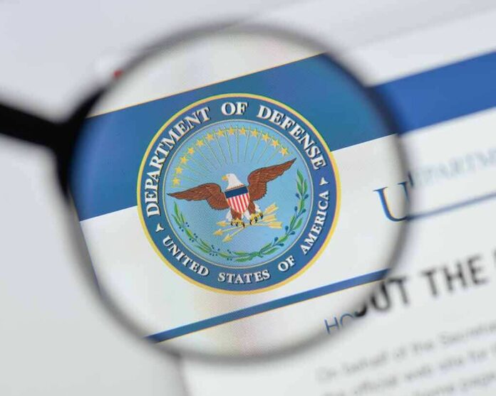 magnifying glass focusing on U.S. Department of Defense seal