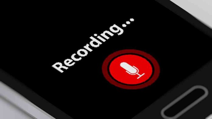 smartphone screen showing a red microphone recording button