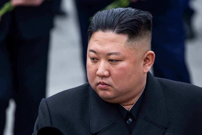 shutterstock_1385497733 Kim Jong-Un looking to the side in a dark overcoat