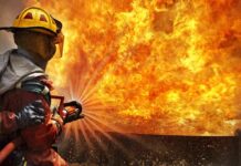 Firefighters Save HISTORIC U.S Church – Blazing Inferno Firefighter spraying water at a large blaze
