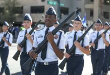 cadets marching in formation with rifles