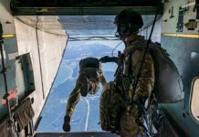 U.S Airman Killed – Stadium Stunt Turns Deadly Paratroopers jump from a military aircraft over coastline