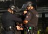 Trans Sex Workers CLASH With City Police Police officers handcuff a person during an arrest