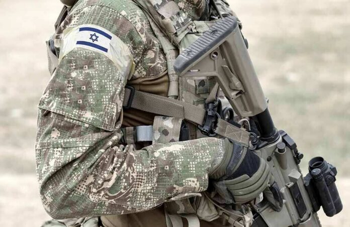 soldier in camouflage holding a rifle