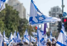 Israel Has First Election Since Oct 7th Attacks Israeli flags waved at a street demonstration