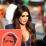 Kimberly Guilfoyle walking outdoors among a crowd