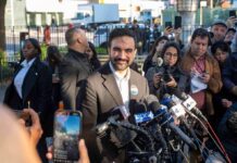 Disgusting: Mamdani Uses Oct. 7 Message to Attack Israel Zohran Mamdani speaks at a press conference; Julia Bacha is visible among the crowd