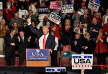 Trump Admits to ‘Checking Out’ Senators Body Donald Trump addresses a rally crowd at a podium, raising his fist