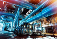 Bipartisan Revolt Slams Trump’s Russia Diesel Deal Industrial plant with large metal pipes and gauges