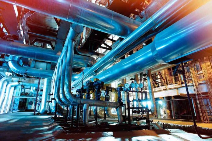 shutterstock_567556192 Industrial plant with large metal pipes and gauges