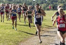 High School Teams Walkout Over Midseason Switch Courtney Bruce and Adelina Sotnikova running in a cross-country race with a large pack